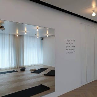 Intoku Yoga & Ayurveda - Practice room with mirror